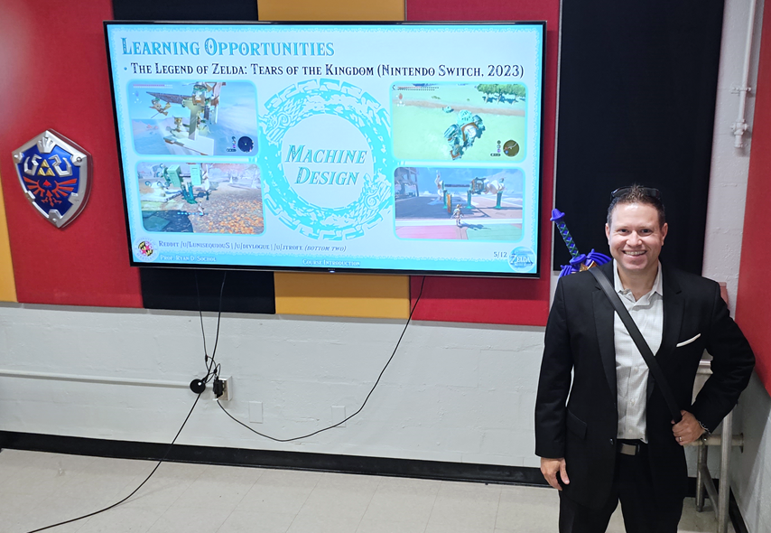 University of Maryland professor stands in front of projection screen for his engineering course based on the popular Legend of Zelda video game